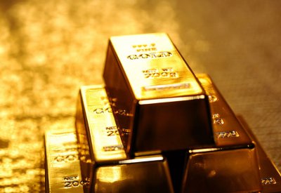 الذهب يتراجع مع تعافي الدولار بعد إغلاق الحكومة الأمريكية
