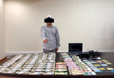القبض على آسيوي بحوزته عدد من البطاقات الائتمانية المزورة