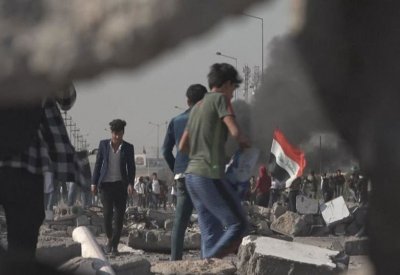 مواجهات وسط بغداد. .رصاص وغاز و7 مصابين