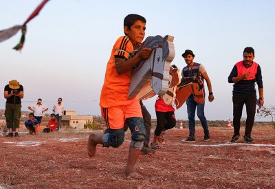 بالصور: "أولمبياد الخيام".. أطفال يتنافسون في شمال غرب سوريا