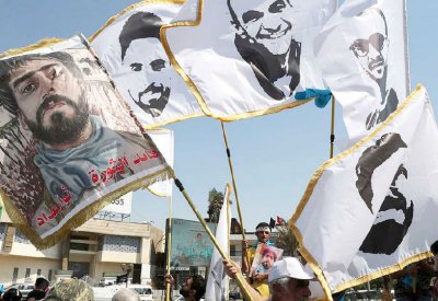 تظاهرة حاشدة في بغداد.. وصور لناشطين مغدورين
