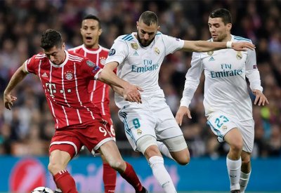 ليفاندوفسكي يصر على برشلونة بسبب بنزيمة