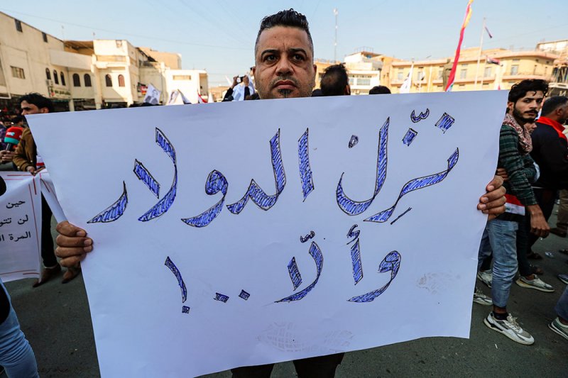 ما الأسباب الحقيقية لأزمة الدينار العراقي؟