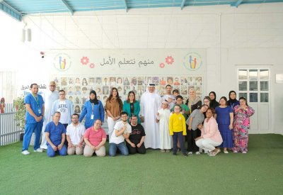 وفد من كلية البحرين الجامعية يزور مركز العناية بمتلازمة داون