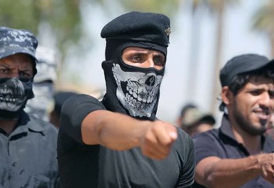 "كتائب حزب الله" بالعراق تلوح بعمليات انتحارية دعما لإيران